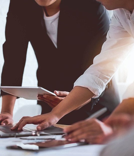 Business professionals discussion with tablet